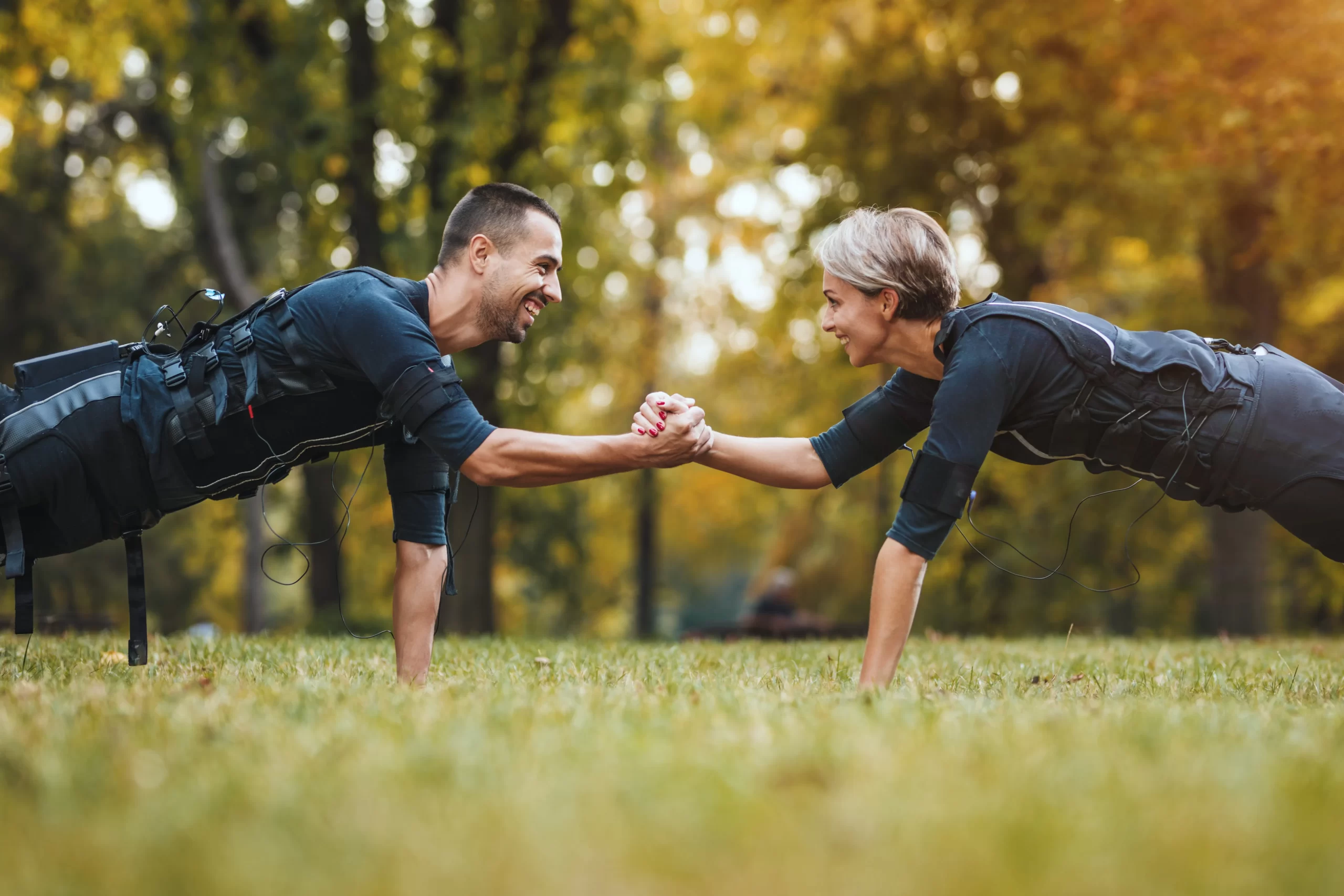 Couple stretching together outdoors
